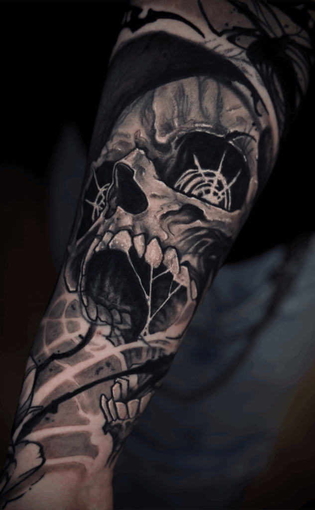 horror skull blackwork tattoo