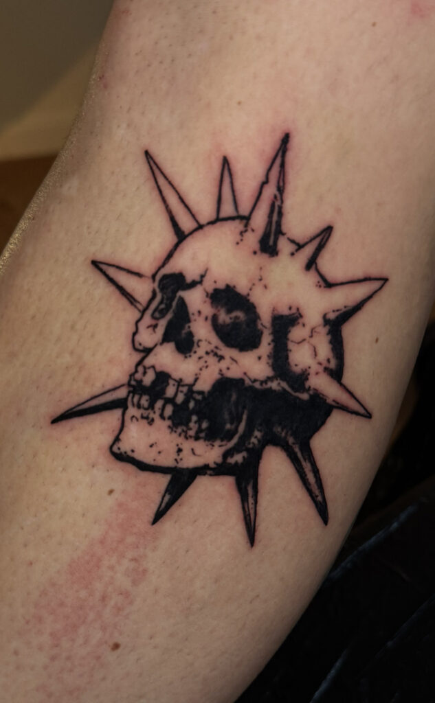 skull bomb little blackwork tattoo